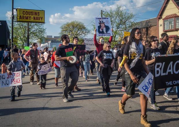 Photo of protestors marching down High Street