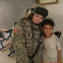 Female solider and little child