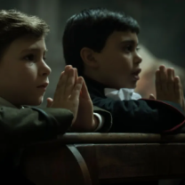 Two little boys praying