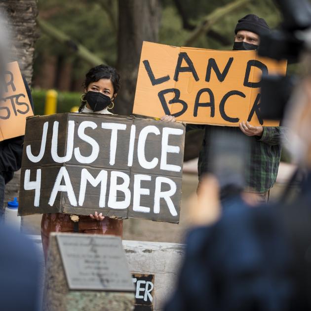 Protestors holding signs